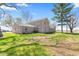 Rear of a well-kept brick home with an extensive lawn at 4155 S State Rd 39, Lebanon, IN 46052