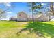 Exterior view displaying a brick home with an extensive lawn at 4155 S State Rd 39, Lebanon, IN 46052