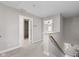 Upstairs hallway featuring access to the bathroom and an extra bedroom at 4155 S State Rd 39, Lebanon, IN 46052
