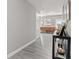 Long hallway with gray wood floors featuring a view to the outside at 4155 S State Rd 39, Lebanon, IN 46052