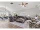 Spacious living room featuring a gray sectional sofa, vaulted ceiling, and modern decor at 4155 S State Rd 39, Lebanon, IN 46052