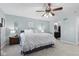 Spacious main bedroom featuring neutral decor and a decorative ceiling fan with overhead lighting at 4155 S State Rd 39, Lebanon, IN 46052
