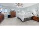 Bright main bedroom featuring neutral decor, large windows, and carpeted flooring at 4155 S State Rd 39, Lebanon, IN 46052