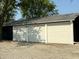 Three-car garage features a metal roof and white siding at 4155 S State Rd 39, Lebanon, IN 46052