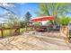 Large wooden deck perfect for outdoor dining, with table, chairs, and umbrella included in backyard at 4322 Matrea More Ct, Indianapolis, IN 46254