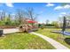 Deck with outdoor table, chairs, and BBQ, overlooking a well-kept backyard at 4322 Matrea More Ct, Indianapolis, IN 46254