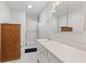 Bright bathroom featuring a shower, white vanity, medicine cabinet, and updated lighting fixture at 4322 Matrea More Ct, Indianapolis, IN 46254