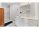 Bright bathroom featuring a shower, white vanity, medicine cabinet, and updated lighting fixture at 4322 Matrea More Ct, Indianapolis, IN 46254