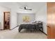 Bedroom with natural light from the window, ceiling fan, and closet access at 4322 Matrea More Ct, Indianapolis, IN 46254