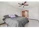 Bedroom with ceiling fan and view to the staircase from the adjacent room at 4322 Matrea More Ct, Indianapolis, IN 46254
