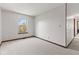 A spacious bedroom featuring neutral carpet and a window offering plenty of natural light at 4322 Matrea More Ct, Indianapolis, IN 46254