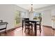 Dining area with hardwood floors, a chandelier and lots of natural light at 4322 Matrea More Ct, Indianapolis, IN 46254
