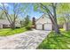 Charming home featuring a well-manicured lawn and a two-car garage with brick detailing at 4322 Matrea More Ct, Indianapolis, IN 46254