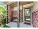 Inviting front porch with brick accents, bench, and a glass-paneled front door at 4322 Matrea More Ct, Indianapolis, IN 46254