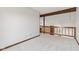 Open hallway featuring neutral carpet and wooden details at 4322 Matrea More Ct, Indianapolis, IN 46254