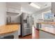 Kitchen featuring light wood countertops and stainless steel refrigerator at 4322 Matrea More Ct, Indianapolis, IN 46254