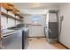 This laundry room is equipped with updated appliances and has plenty of extra storage at 4322 Matrea More Ct, Indianapolis, IN 46254