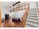Spacious living room with hardwood floors, high ceilings, and a staircase at 4322 Matrea More Ct, Indianapolis, IN 46254