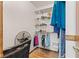 Organized walk-in closet with shelving, clothes rack, and additional space for storage at 4322 Matrea More Ct, Indianapolis, IN 46254