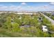Beautiful aerial view of homes surrounded by lush trees and greenery in an industrial neighborhood at 4450 Bridgefield West Dr, Plainfield, IN 46168