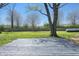 Backyard view featuring a wooden deck and mature tree providing shade at 4450 Bridgefield West Dr, Plainfield, IN 46168