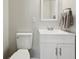 Bathroom with a white vanity, sleek faucet, toilet, mirror and freshly painted neutral walls at 4450 Bridgefield West Dr, Plainfield, IN 46168