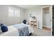 Charming bedroom with ample natural light, storage shelves, and a cozy seating area at 4450 Bridgefield West Dr, Plainfield, IN 46168