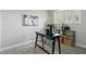 Home office with a black desk, stylish lamp, and decorative artwork at 4450 Bridgefield West Dr, Plainfield, IN 46168