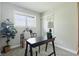 Home office with a desk, shelving, and natural light from a window at 4450 Bridgefield West Dr, Plainfield, IN 46168