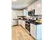 Bright kitchen featuring stainless steel appliances and ample white cabinet space at 4450 Bridgefield West Dr, Plainfield, IN 46168