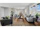 Spacious living room featuring stylish furniture, a jute rug, and plenty of room for entertaining at 4450 Bridgefield West Dr, Plainfield, IN 46168