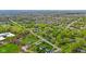 An aerial shot showcases a charming residential area with tree-lined streets and diverse housing styles at 4525 Shelbyville Rd, Indianapolis, IN 46237