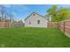Backyard featuring green grass and a wooden fence at 4525 Shelbyville Rd, Indianapolis, IN 46237