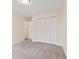 This bedroom features neutral carpet, and a double door closet at 4525 Shelbyville Rd, Indianapolis, IN 46237