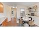 Cozy dining area featuring a round table with four chairs and built-in shelving for decor at 4525 Shelbyville Rd, Indianapolis, IN 46237