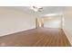 The living room boasts wood floors, a ceiling fan, and a chandelier for a spacious area at 4525 Shelbyville Rd, Indianapolis, IN 46237