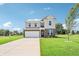 Beautiful two-story home with a two-car garage, brick and siding, and a well-kept lawn at 4718 E Shadowbrook Dr, Camby, IN 46113