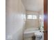 Bathroom with tub, toilet, and window; simple and functional at 476 Southgate Dr, Greenwood, IN 46143