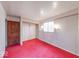 Bedroom featuring red carpet, a closet, and a window for natural light at 476 Southgate Dr, Greenwood, IN 46143