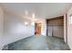 Empty bedroom featuring wall sconces, carpet flooring, open closet, and neutral walls at 476 Southgate Dr, Greenwood, IN 46143