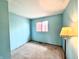 A bright bedroom features paneled walls, carpet, and a window at 476 Southgate Dr, Greenwood, IN 46143