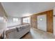 A living room showcases light wood paneling and great natural light, ideal for relaxing at 476 Southgate Dr, Greenwood, IN 46143