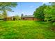 Expansive backyard with lush lawn, showcasing the home's exterior and outdoor living space at 507 S Grant St, Brownsburg, IN 46112