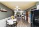 Open living space with dining area, desk space, and white wainscotting at 507 S Grant St, Brownsburg, IN 46112