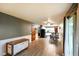 Bright living space with hardwood floors, kitchen view, and sliding door access at 507 S Grant St, Brownsburg, IN 46112