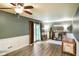 Bright living space with ceiling fan, sliding door, and desk space at 507 S Grant St, Brownsburg, IN 46112