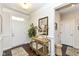 Bright entryway featuring hardwood floors, a mirrored console table, and white doors with decorative trim at 5158 Montview Way, Noblesville, IN 46062
