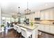 Bright, open-concept kitchen featuring granite countertops, an island with seating, and stainless steel appliances at 5158 Montview Way, Noblesville, IN 46062