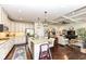 Open-concept kitchen with island seating seamlessly connects to the living room and features modern appliances at 5158 Montview Way, Noblesville, IN 46062