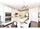 Modern kitchen with white cabinets, stainless steel appliances, granite countertops, and a center island at 5158 Montview Way, Noblesville, IN 46062